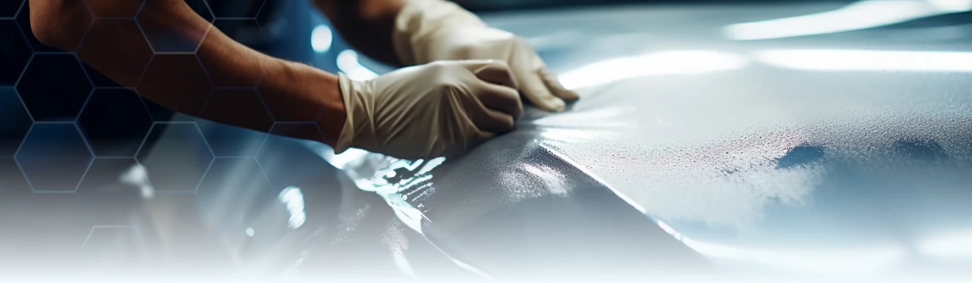 Detailer applying Roxgard paint protection film